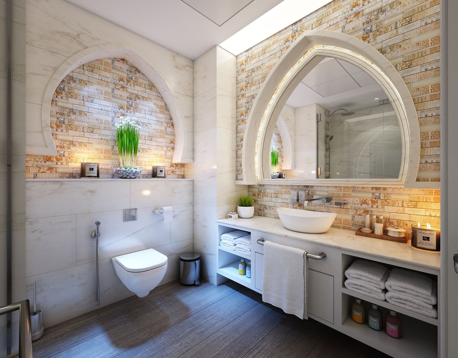 Spa-style remodeled bathroom with vessel sink, marble counters, and warm accent tile