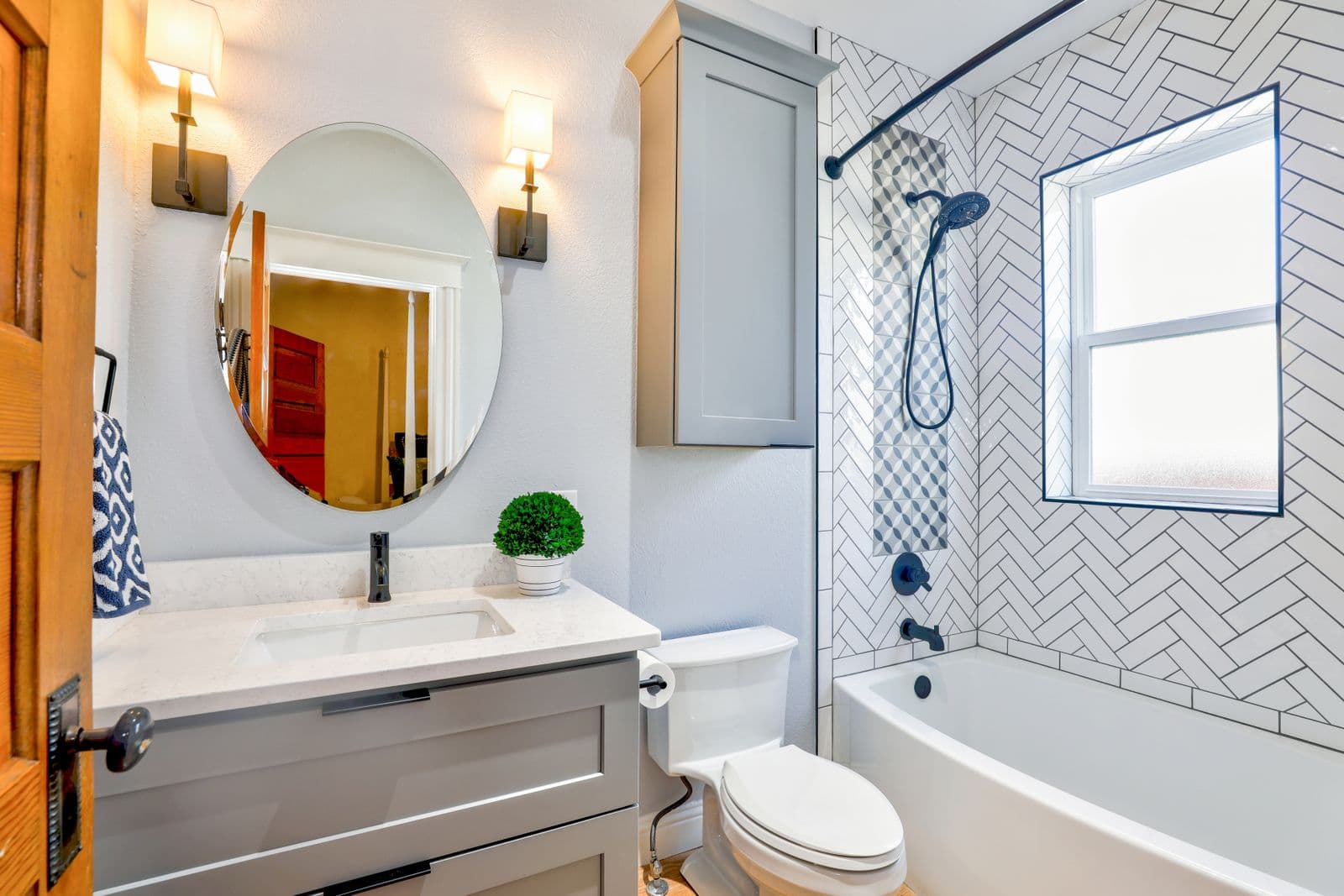 Bathroom concept with herringbone tile surround